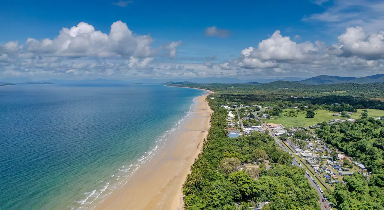 Aerial view of Mission Beach: the beach, the village centre and Mission Beach Hideaway Holiday Village